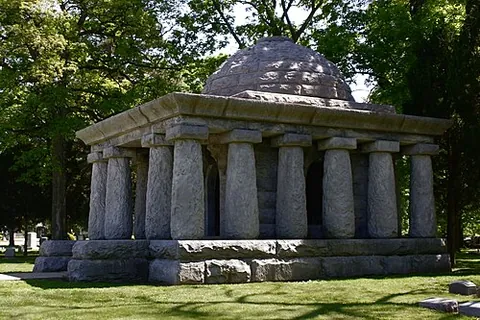 tomb: a small building, or a room within one, for the remains of the dead, with walls, a roof, and (if it...