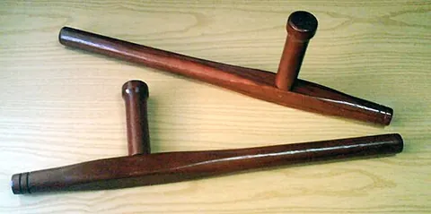 tonfa: a traditional hand-held Okinawan weapon, a wooden stick with a perpendicular handle, traditionally...