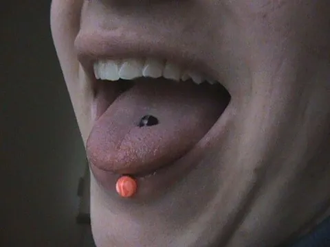 tongue ring: a decorative ring that is worn in a person's pierced tongue