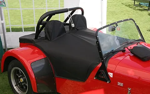 tonneau cover: a protective covering which may be secured over the exposed portion of a motor vehicle, such as the...