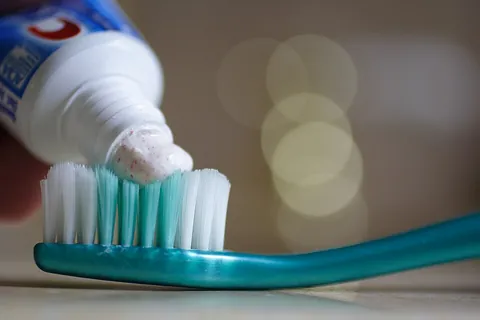 toothpaste: a paste, normally used with a toothbrush, for cleaning the teeth