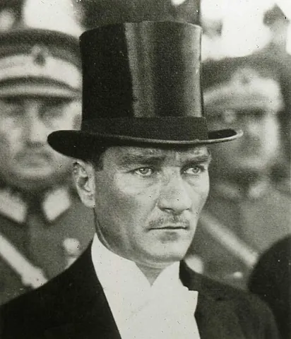 top hat: a man's formal hat, with a tall cylindrical crown (often of silk)