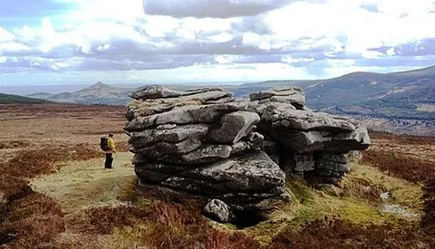 tor: a craggy outcrop of rock on the summit of a hill, created by the erosion and weathering of rock