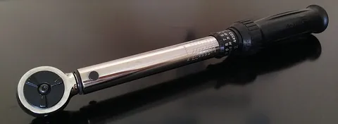 torque wrench: a workshop tool used to precisely apply a specific torque to a fastener such as a nut or bolt; it...