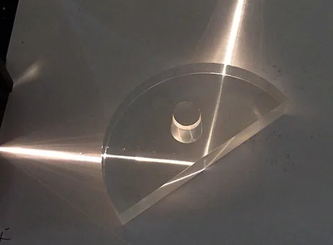total internal reflection: a phenomenon where light, instead of passing into a medium of a lower refractive index and...