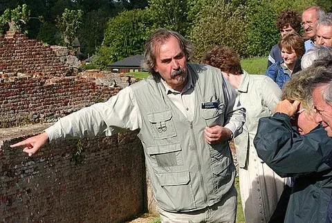 tour guide: one who provides assistance and information to people on organised tours