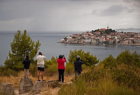 tourist: someone who travels for pleasure rather than for business; a leisure visitor