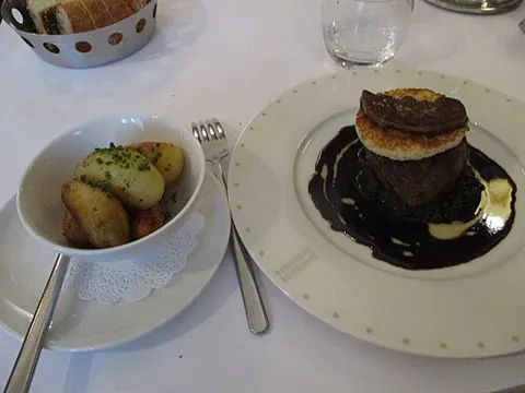 tournedos rossini: a French dish comprising beef tournedos pan-fried in butter, served on a crouton, topped with a hot...