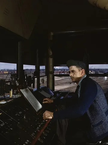 towerman: a person employed in a railroad switch tower to control and direct the movement of cars and trains