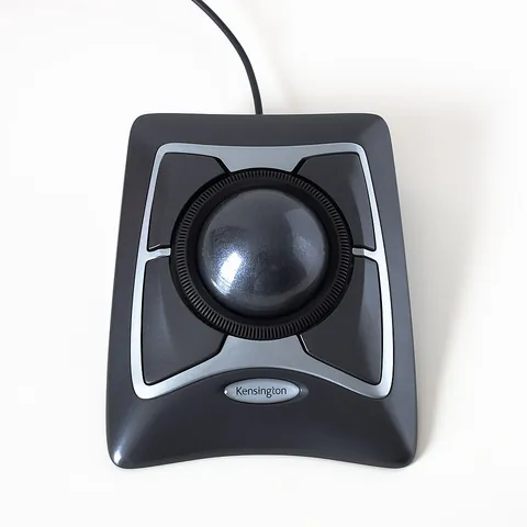 trackball: a pointing device consisting of a ball housed in a socket