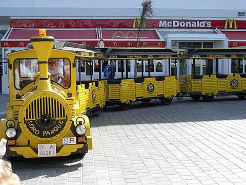trackless train: a road-going passenger transportation articulated vehicle