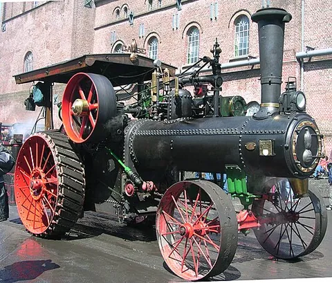 traction engine: a wheeled steam engine used to move heavy loads, plough ground or provide power at a chosen location