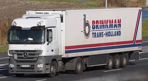 tractor-trailer: a large truck consisting of an engine and cab section (the tractor) and a cargo-carrying...