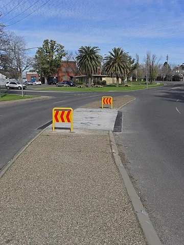 traffic island: a raised or otherwise marked area in a roadway from which traffic is excluded, so as to direct the...