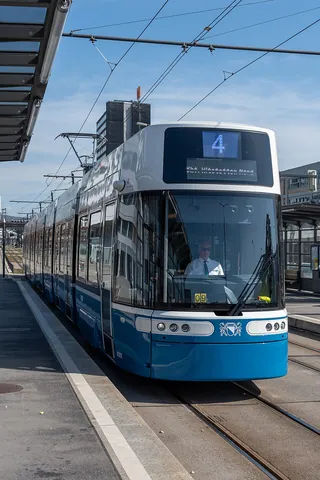 tram: a passenger vehicle for public use that runs on tracks in the road (called a streetcar or trolley...