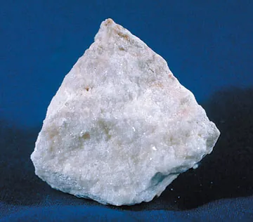 travertine: a light, porous form of concretionary limestone (or calcite) deposited from solution, and sometimes...
