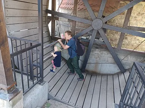 treadwheel: a large wheel turned by treading, climbing, or pushing with the feet upon its periphery, as for...