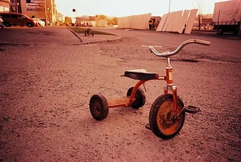 tricycle: a cycle with three wheels, powered by pedals and usually intended for young children