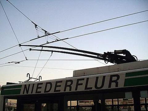 trolley pole: a pole of wood or metal, used to transfer electricity from an overhead wire to power a tram,...