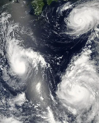 tropical cyclone: a rapidly rotating storm system characterized by a low-pressure center, strong winds, and a...