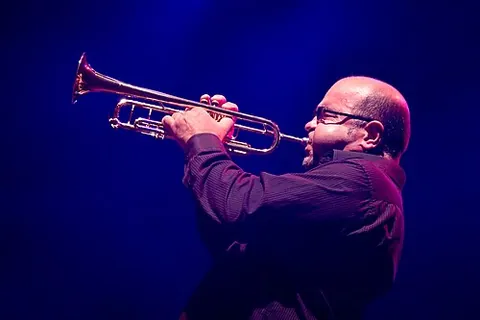 trumpeter: someone who plays a trumpet