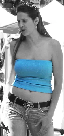 tube top: a one-piece strapless tube-shaped top worn by women, leaving shoulders and belly-button exposed