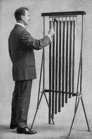 tubular bells: a percussion instrument consisting of a set of tuned metal tubes that are struck with a mallet,...