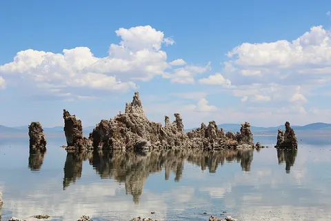 tufa: calcareous lime deposited by precipitation from a body of water, such as a hot spring