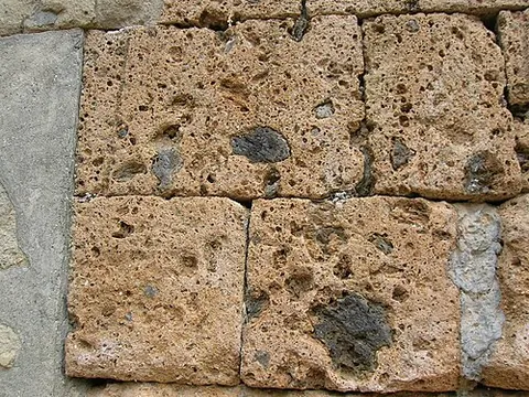 tuff: a light porous rock, now especially a rock composed of compacted volcanic ash varying in size from...