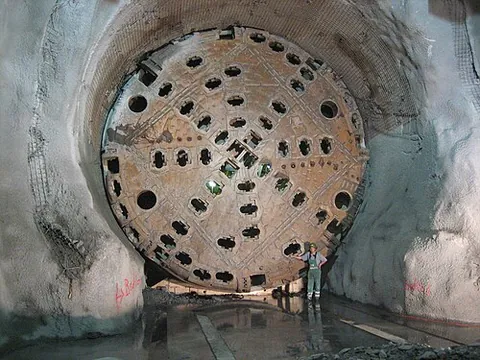 tunnel boring machine: a large machine used to excavate tunnels with a circular cross section