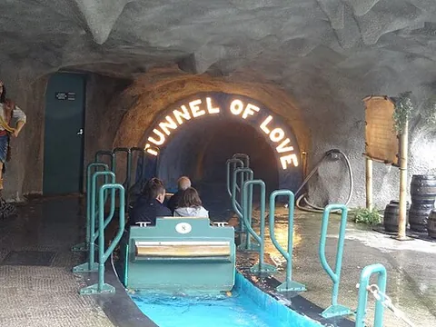 tunnel of love: a carnival dark ride for couples in boats, either relaxing and romantic, or spooky (encouraging the...