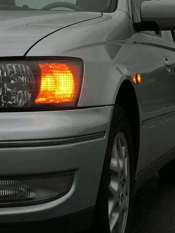 turn signal: each of the flashing lights on each side of a vehicle which is used to indicate the vehicle is...