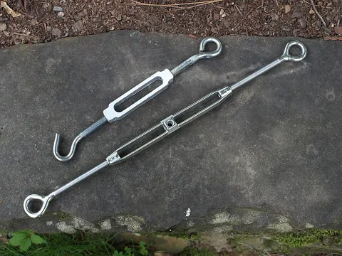turnbuckle: a coupling device consisting of two eyelets or other connection points connected in screw threads