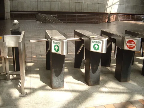 turnstile: a rotating mechanical device that controls and counts passage between public areas, especially one...