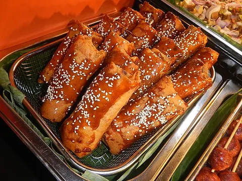 turon: a Philippine snack made of a fried and caramelized spring roll wrapping thinly sliced bananas