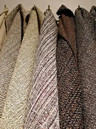 tweed: a coarse woolen fabric used for clothing
