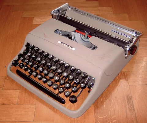 typewriter: a device, at least partially mechanical, used to print text by pressing keys that cause type to be...