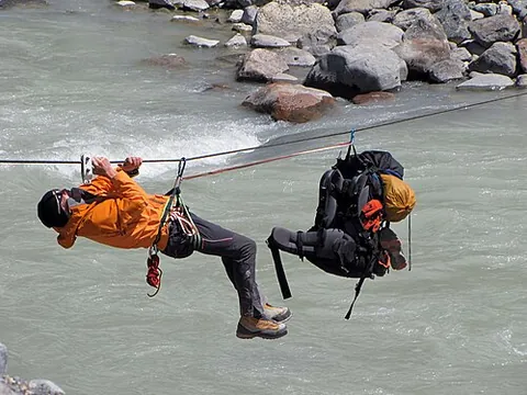 tyrolean traverse: a method of crossing through free space between two high points on a rope without a hanging cart or...