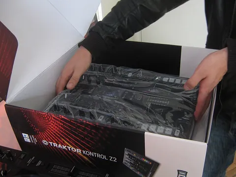 unbox: to remove from a box