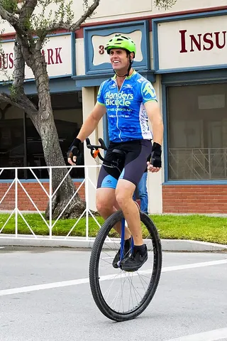 unicyclist: a person who rides a unicycle