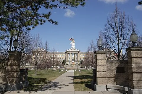 university: an institution of higher education that provides facilities for teaching, research, and the...