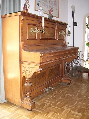 upright piano: a type of piano with vertically mounted strings