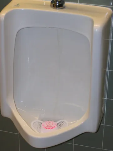 urinal: a device or fixture used for urination, particularly
