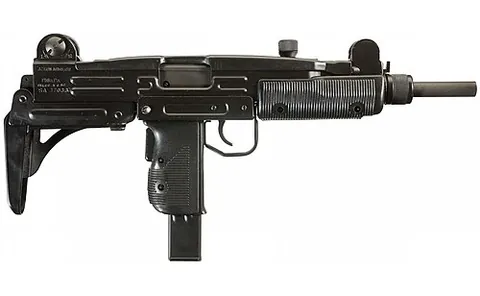uzi: a type of compact submachine gun, having a caliber of 9 millimeters with ammunition housed in the...