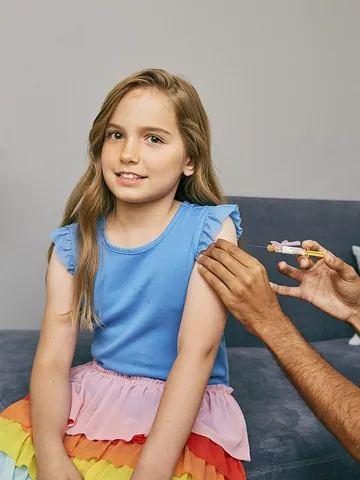 vaccinate: to treat (a person or an animal) with a vaccine to produce immunity against a disease