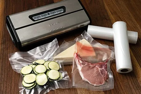 vacuum sealer: a machine to vacuum pack (to pack something in an airtight container from which some or all of the...