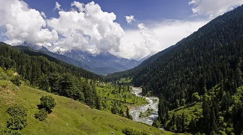 valley: an elongated depression cast between hills or mountains, often with a river flowing through it