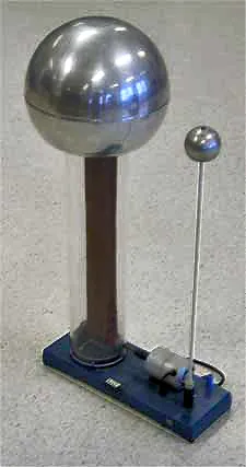 van de graaff generator: a device in which an electric charge is built up on a large spherical electrode by means of a...