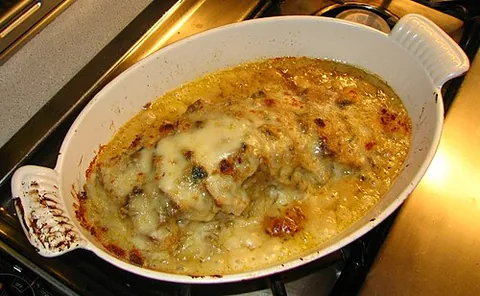 veal orloff: a dish of thinly sliced braised loin of veal with duxelles and soubise layered between the slices,...