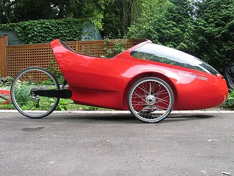 velomobile: a human-powered vehicle, typically a recumbent tricycle with an outer fairing for aerodynamic...